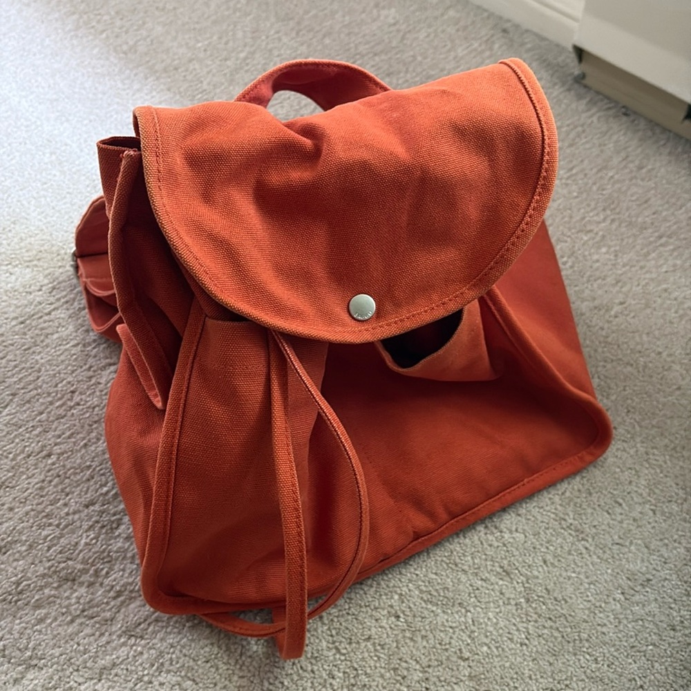 Baggu orange drawstring backpack with pockets, lightly worn